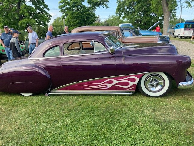 Purple custom coupe with flame paint job