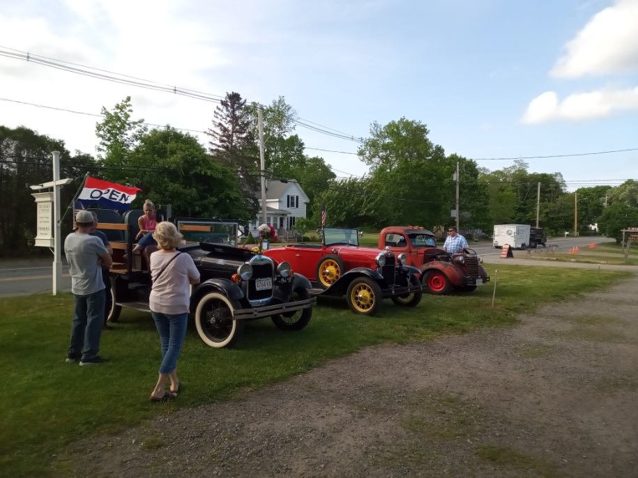 Classic cars and antique trucks lined up at Todd Farm